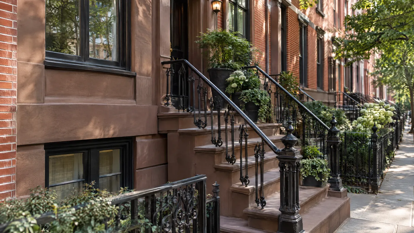 Restored brownstone stoop and facade with fresh mortar joints in Brooklyn